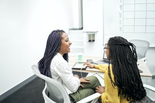 two-young-black-women-working-in-the-office-revie-2022-08-11-00-04-54-utc